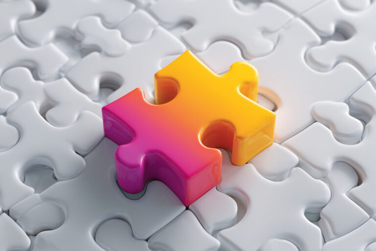 Nearly complete puzzle of uniform pieces with one single piece that is very different from all of the other plain jigsaw pieces, symbolising product or company differentiation